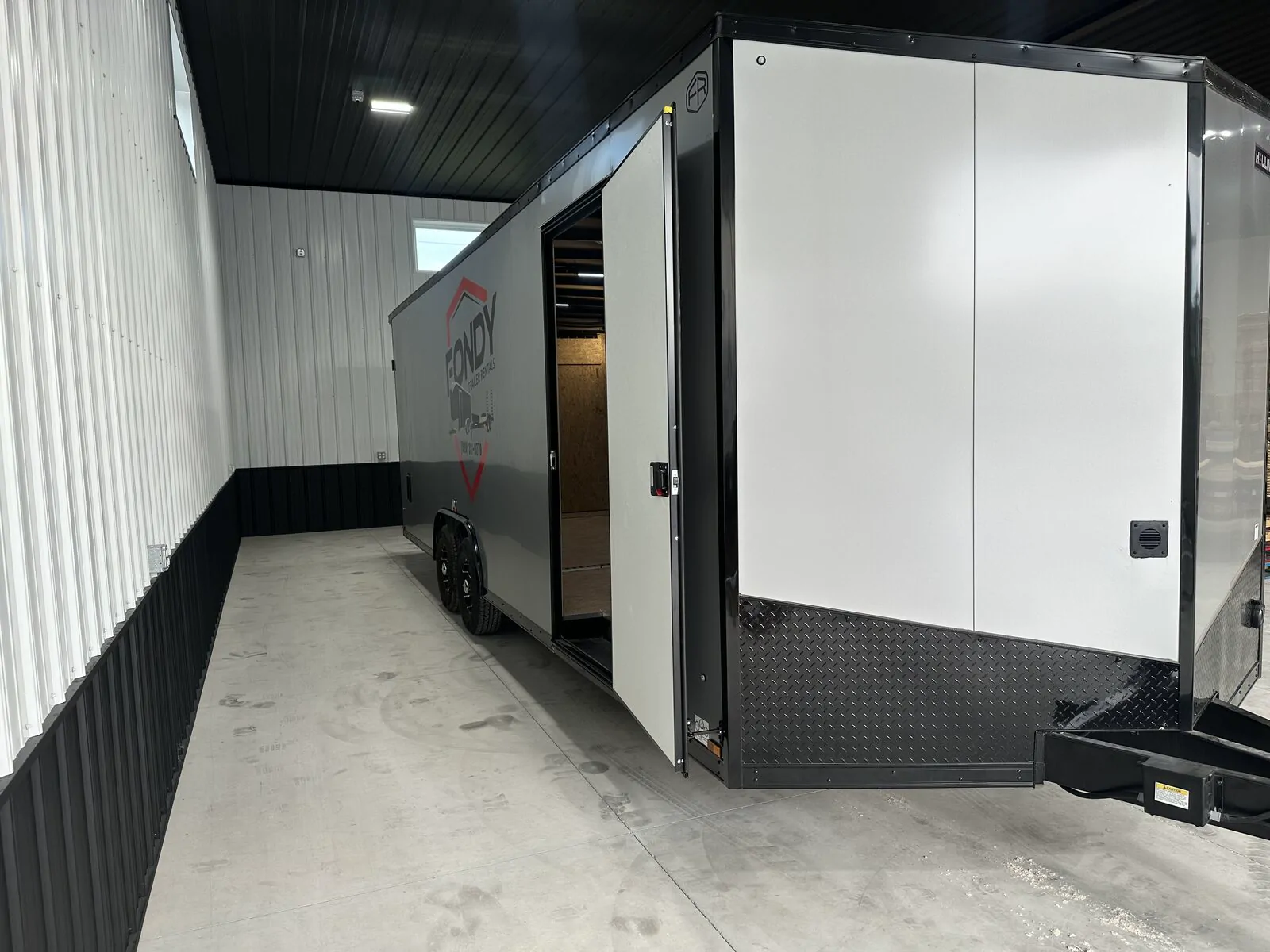 Enclosed car hauler trailer in Fond du Lac, Wisconsin, suitable for moving a hot tub