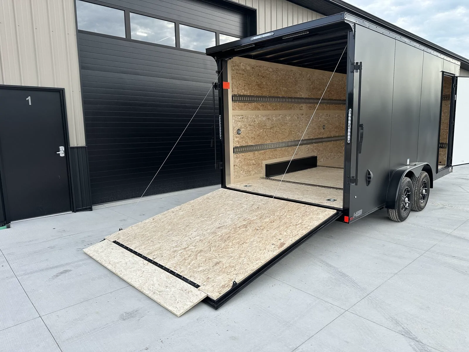 7.5 by 16 foot enclosed trailer with the full-width rear ramp lowered, Fond du Lac, Wisconsin